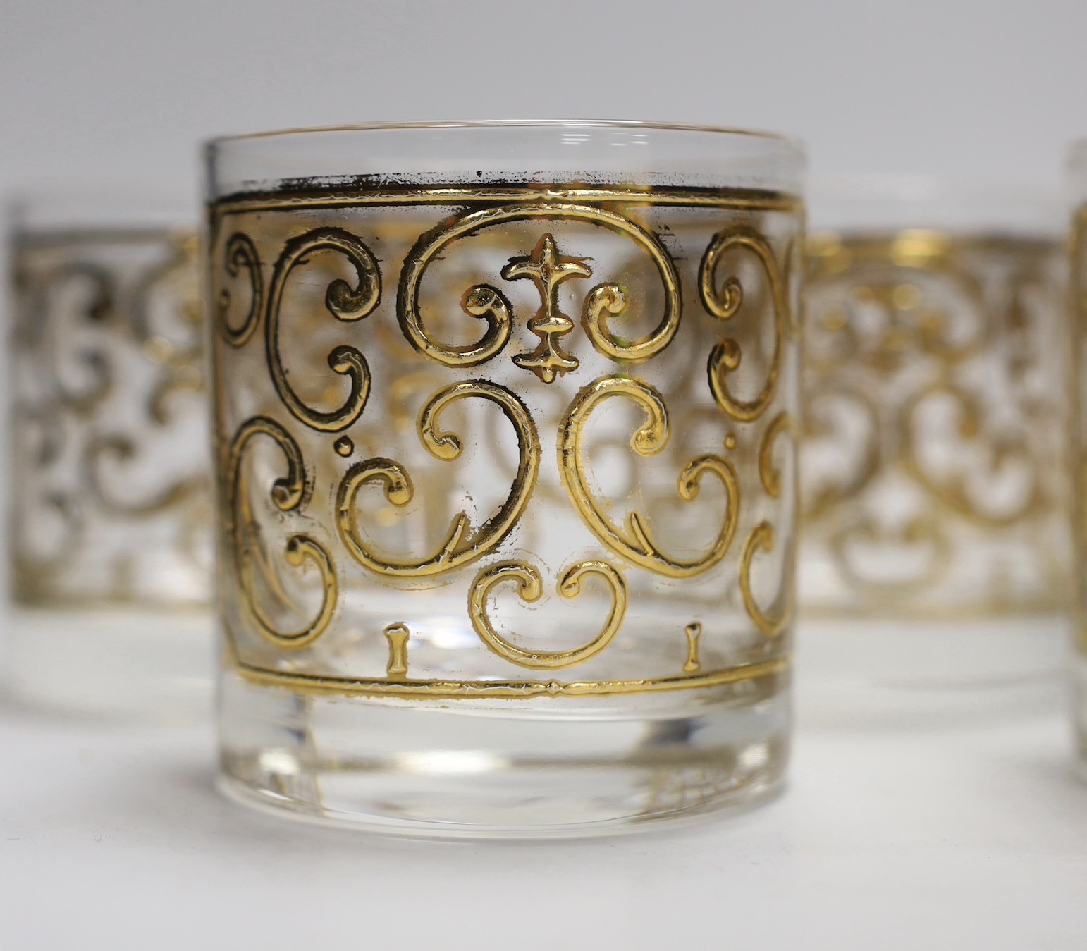 A set of seven Georges Briard gilded glass tumblers